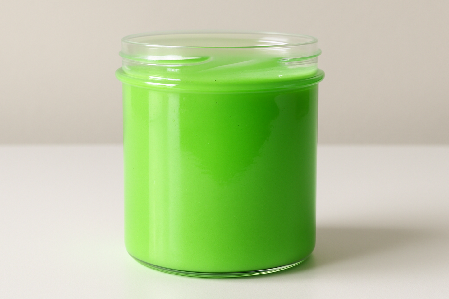 baby green plain colour slime in a slightly tall container